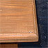Close-up detail of a large pine table