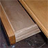 Close-up detail of a large pine table