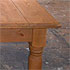 Close-up detail of a large pine table