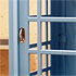 Close-up detail of the door of an old-style telephone box
