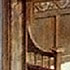 Close-up detail of a stage set - carved settle