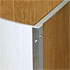 Close-up detail of a curved, white-veneered washing basket