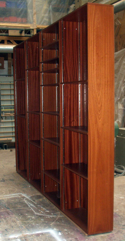 Side view of a set of tall free-standing bookshelves