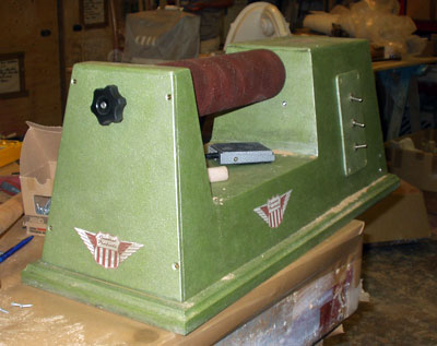 Three-quarter view of an old fashioned free-standing sanding machine