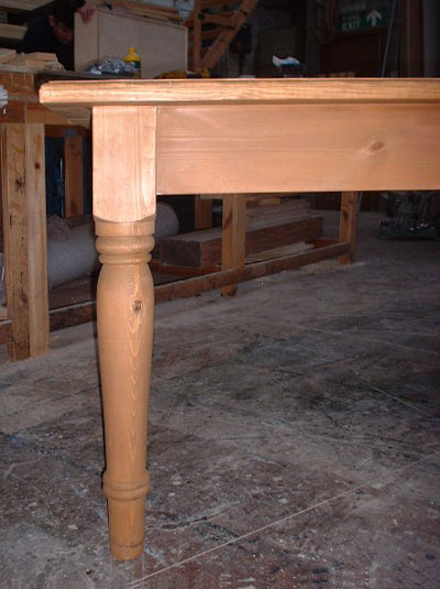 Close up of the top of the leg of a pine table