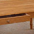 Close-up detail of a large pine table